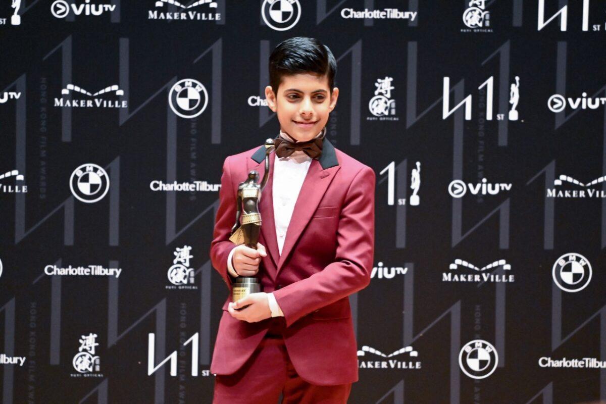 Hong Kong actor Sahal Zaman poses with his statuette for winning the Best Newcomer award at the 41st Hong Kong Film awards in Hong Kong on April 16, 2023. (Peter Parks/AFP)