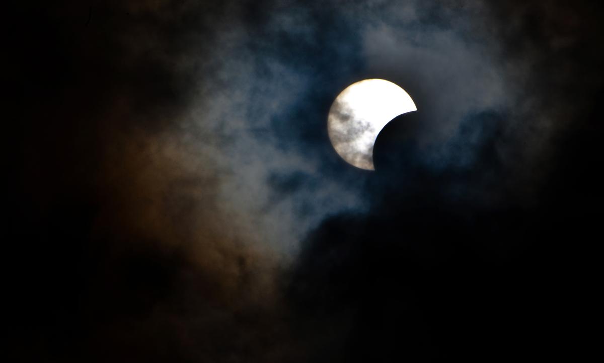 A rare hybrid solar eclipse seen through clouds from the Canary Island of Tenerife in November 2013. (DESIREE MARTIN/AFP via Getty Images)
