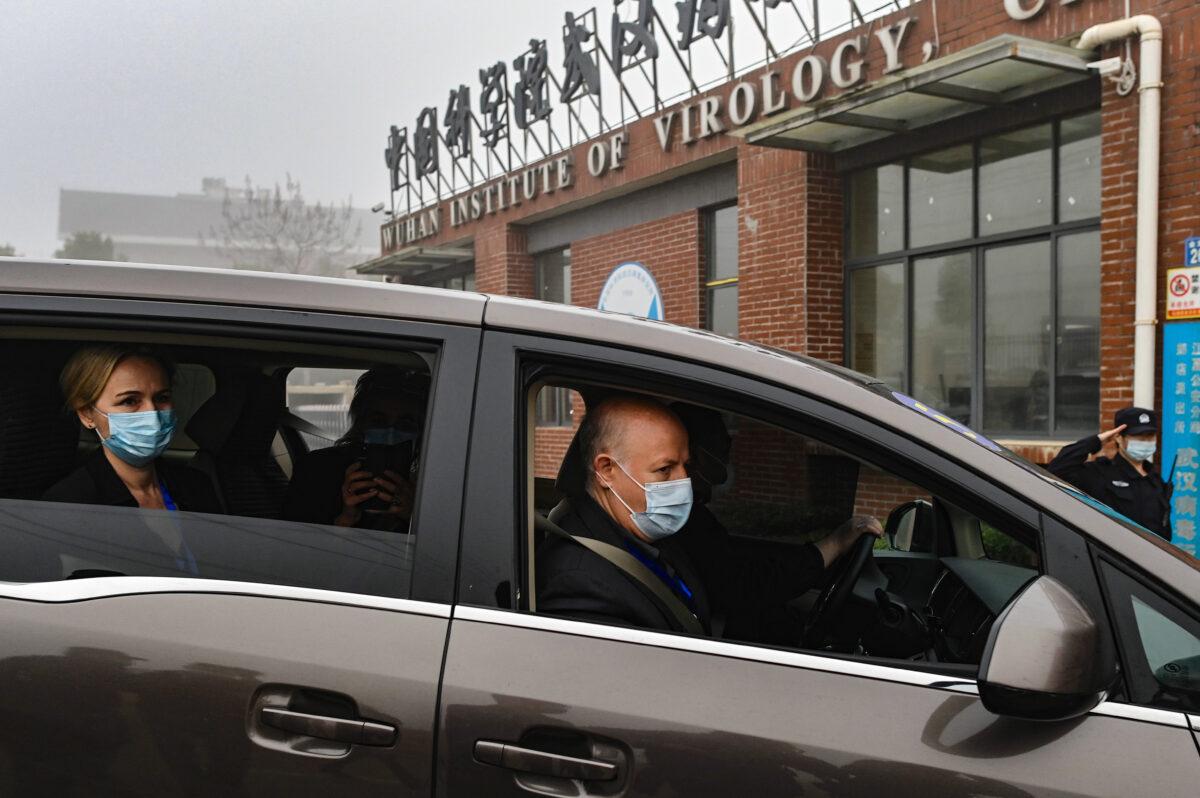 Peter Daszak of the EcoHealth Alliance (R) and other members of the World Health Organization team investigating the origins of the virus that causes COVID-19, arrive at the Wuhan Institute of Virology on Feb. 3, 2021. (Hector Retamal/AFP via Getty Images)