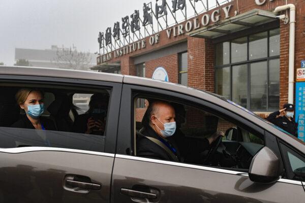 Peter Daszak (R) and other members of the World Health Organization (WHO) team investigating the origins of the COVID-19 coronavirus arrive at the Wuhan Institute of Virology, in China's Wuhan city, on Feb. 3, 2021. (Hector Retamal/AFP via Getty Images)