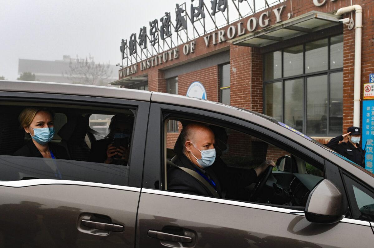 Peter Daszak (R) and other members of the World Health Organization (WHO) team investigating the origins of the COVID-19 coronavirus arrive at the Wuhan Institute of Virology on Feb. 3, 2021. (Hector Retamal/AFP via Getty Images)