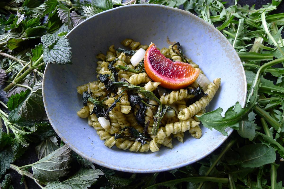Pesto turns the strength of wild flavors into an asset. Here, fusilli is tossed with a dandelion and nettle pesto and fried nettle. (Ari LeVaux)