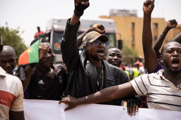 People take part in a march called by the opposition to protest against the security situation worsening and asking for a response to jihadist attacks, in Ouagadougou, Burkina Faso, on July 3, 2021. (Olympia de Maismont/AFP via Getty Images)