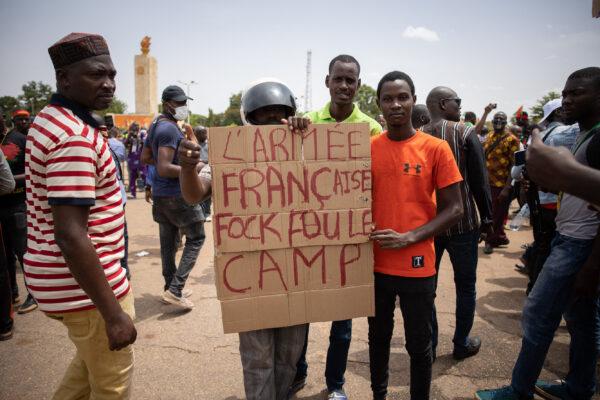 Demonstrators hold a placard in a march called by the opposition to protest against the security situation worsening and asking for a response to jihadist attacks, in Ouagadougou, on July 3, 2021. (Olympia de Maismont/AFP via Getty Images)
