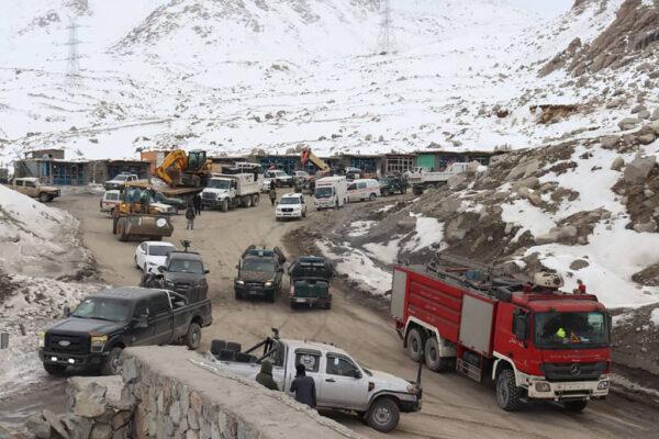 Vehicles and rescue teams are pictured at the site of a deadly oil tanker fire at the Salang Pass tunnel in Parwan Province, Afghanistan, on Dec. 19, 2022. (STR/AFP via Getty Images)