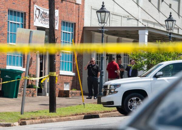 Law enforcement investigating a shooting at Mahogany Masterpiece dance studio in Dadeville, Ala., on April 16, 2023. (Jake Crandall/The Montgomery Advertiser via AP)