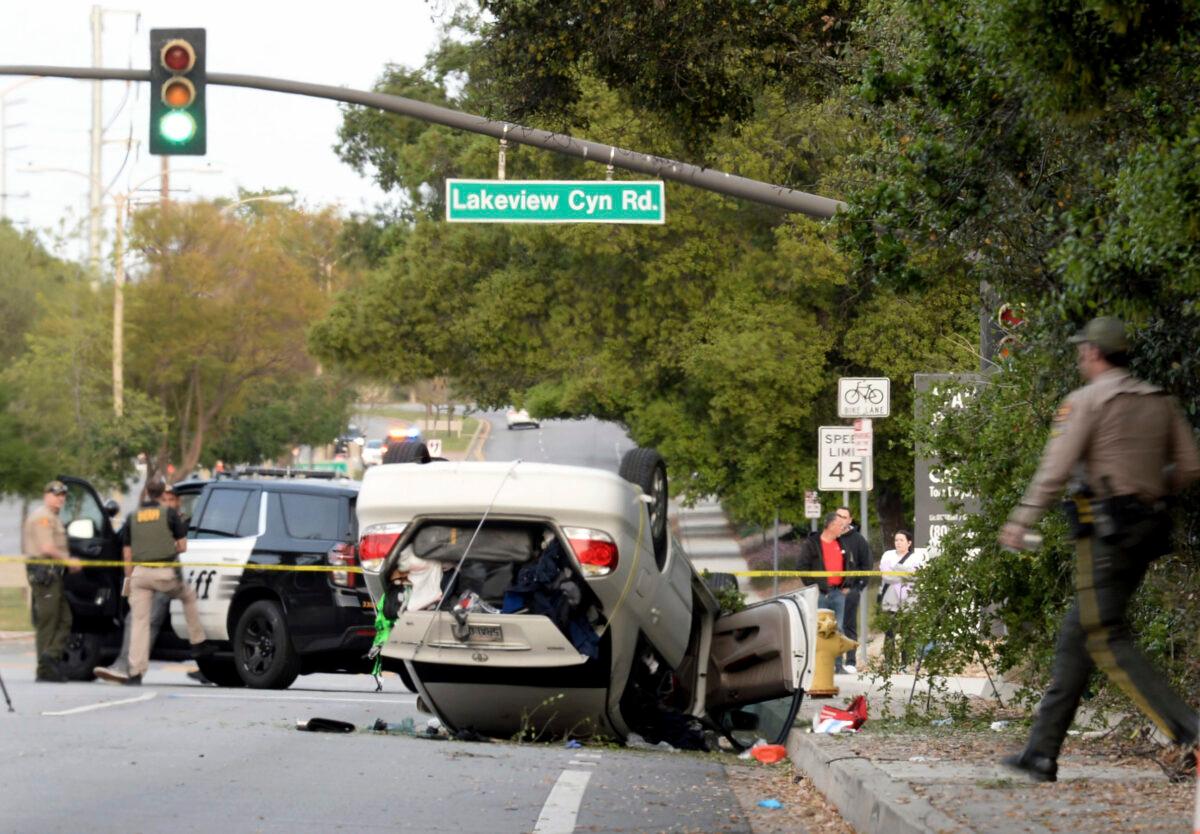 Ventura County Sheriff's Office personnel investigate the scene where a teenager was killed and three others injured after a stabbing suspect crashed his vehicle into the group as they were walking near their high school in Thousand Oaks, Calif., on April 18, 2023. (Juan Carlo/Ventura County Star via AP)