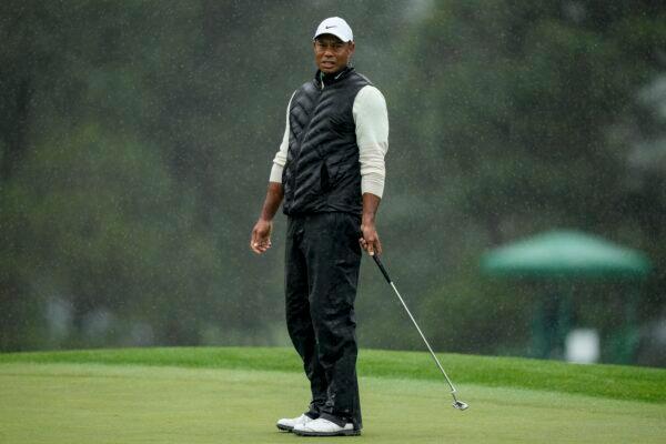 Tiger Woods reacts after missing a putt on the 18th hole during the weather delayed second round of the Masters golf tournament at Augusta National Golf Club in Augusta, Ga., on April 8, 2023. (Charlie Riedel/AP Photo)