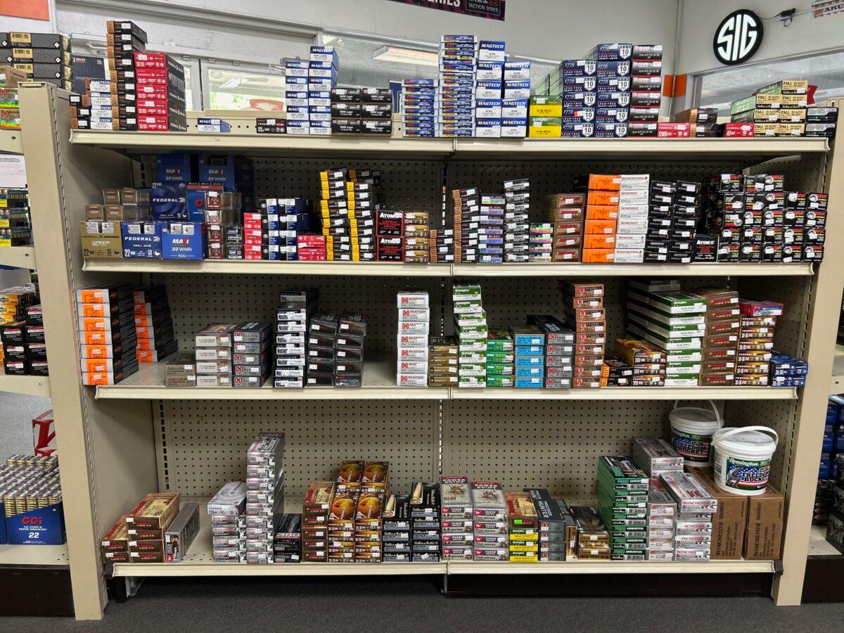 Shelves are stocked with ammunition at Lawful Defense in Gainesville, Fla., on April 19, 2023. (Nanette Holt/The Epoch Times)