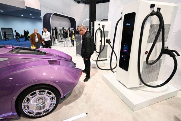 A Hispano Suiza Carmen Boulogne electric super car is displayed in front of an NB 480 electric vehicle power-charging station at the Power Electronics booth during the Consumer Electronics Show (CES) in Las Vegas on Jan. 6, 2023. (Patrick T. Fallon/AFP via Getty Images)