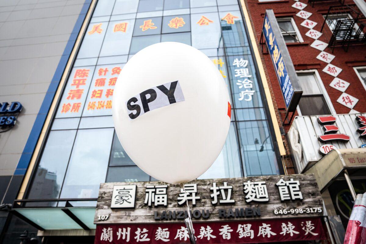 A balloon is held at a press conference and rally in front of the America ChangLe Association highlighting Beijing's transnational repression, in New York, on Feb. 25, 2023. A now-closed overseas Chinese police station was located inside the association building.(Samira Bouaou/The Epoch Times)