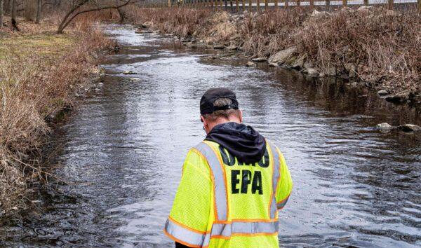 Ron Fodo, Ohio EPA Emergency Response, checks for chemicals that have settled at the bottom of a creek following a Feb. 3, 2023 train derailment causing environmental concerns in East Palestine, Ohio on Feb. 20, 2023. (Michael Swensen/Getty Images)
