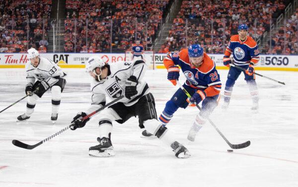 Los Angeles Kings' Drew Doughty (8) tries to stop Edmonton Oilers' Leon Draisaitl (29) during the second period of Game 2 in an NHL hockey Stanley Cup first-round playoff series in Edmonton, Alberta, on April 19, 2023. (Jason Franson/The Canadian Press via AP)