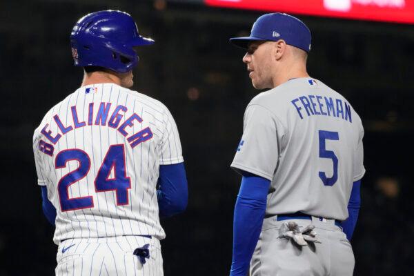 Chicago Cubs' Cody Bellinger, left, talks with Los Angeles Dodgers first baseman Freddie Freeman during the third inning of a baseball game in Chicago, on April 20, 2023. (Nam Y. Huh/AP Photo)