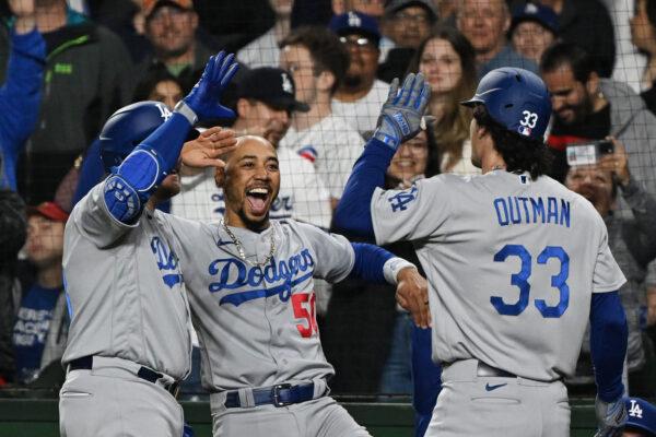 Mookie Betts (50) of the Los Angeles Dodgers congratulates James Outman (33) of the Los Angeles Dodgers for his grand slam home run in the ninth inning against the Chicago Cubs at Wrigley Field in Chicago on April 20, 2023. (Quinn Harris/Getty Images)