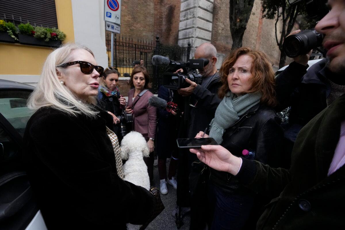 Texas-born Princess Rita Boncompagni Ludovisi (L), born Rita Jenrette Carpenter and last wife of late Prince Nicolo Boncompagni Ludovisi, talks to journalists a she leaves her residence, The Casino dell'Aurora, also known as Villa Ludovisi, during the execution of an eviction order, in Rome on April 20, 2023. (Andrew Medichini/AP Photo)