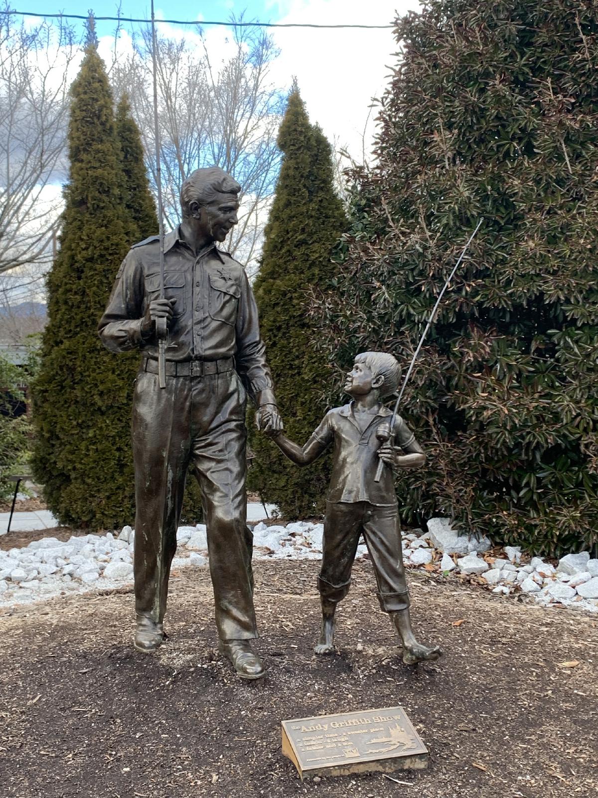 Statues of Andy Griffith (Sheriff Andy Taylor) and Ron Howard (Opie), stars of “The Andy Griffith Show,” are a photo op for tourists in front of the Andy Griffith Museum and Playhouse in Mount Airy, N.C. (Courtesy of Sharon Whitley Larsen)