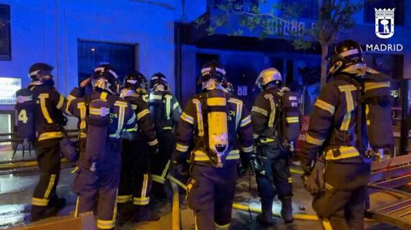 Firefighters gather outside a restaurant following a fire in Madrid on April 21, 2023, in this screen grab taken from a handout video. (Madrid Emergency Service/Handout via Reuters)