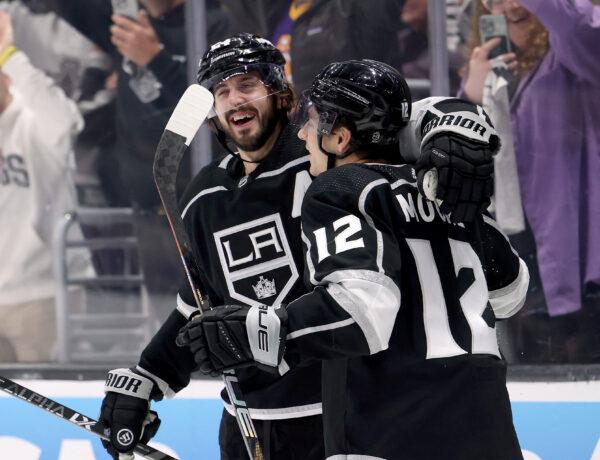 Trevor Moore (12) of the Los Angeles Kings celebrates his goal with Phillip Danault (24) at Crypto.com Arena in Los Angeles on April 21, 2023. (Harry How/Getty Images)