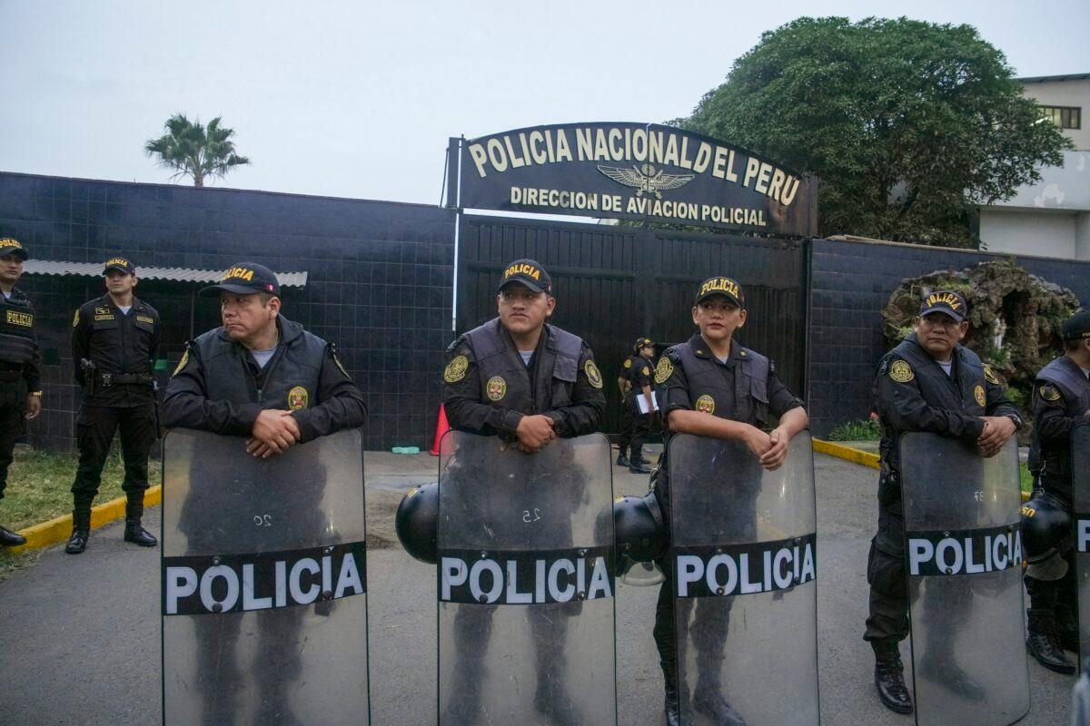 Police guard the entrance to the police terminal next to the international airport from where Peru's former President Alejandro Toledo will be taken to a detention facility after arriving in Lima, Peru, extradited from the United States, on April 23, 2023. (Guadalupe Pardo/AP Photo)
