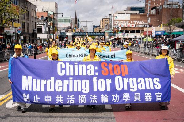 Falun Gong practitioners participate in a parade to call for an end to the Chinese Communist Party's persecution of their faith in the Flushing neighborhood of Queens, N.Y., on April 23, 2023. (Chung I Ho/The Epoch Times)
