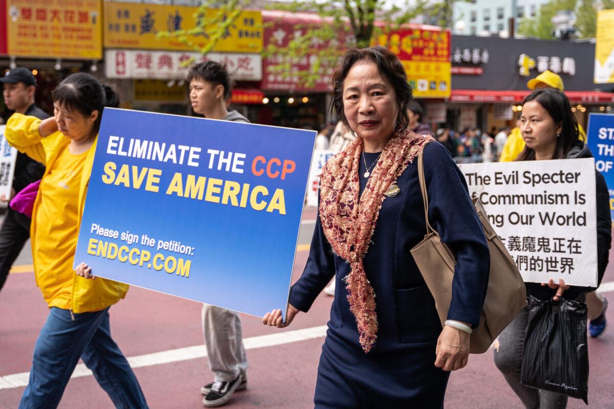 Falun Gong practitioner Zhao Ruoxi participates in a parade to call for an end to the Chinese Communist Party's persecution of her faith in the Flushing neighborhood of Queens, N.Y., on April 23, 2023. (Chung I Ho/The Epoch Times)