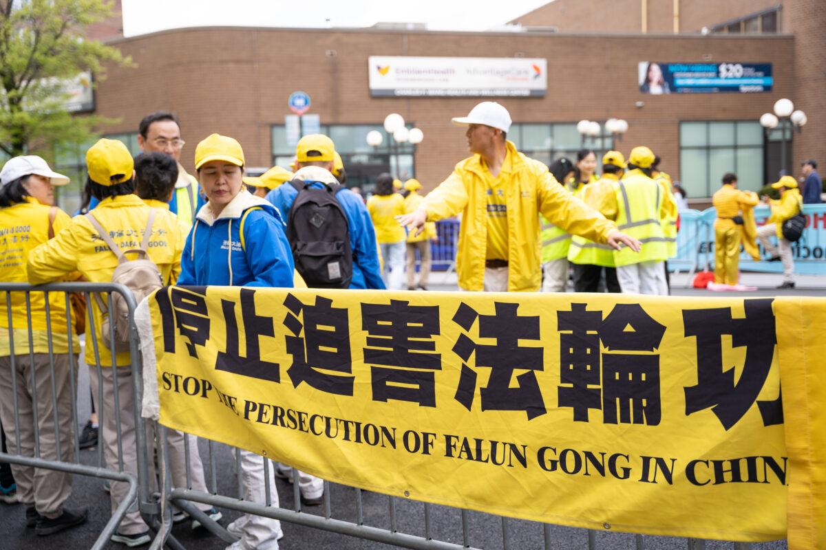 Falun Gong practitioners participate in a parade to call for an end to the Chinese Communist Party's persecution of their faith in the Flushing neighborhood of Queens, N.Y., on April 23, 2023. (Chung I Ho/The Epoch Times)