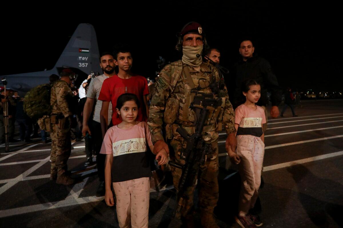 Jordanians evacuated from Sudan arrive at a military airport in Amman, Jordan, on April 24, 2023. (Raad Adayleh/AP Photo)