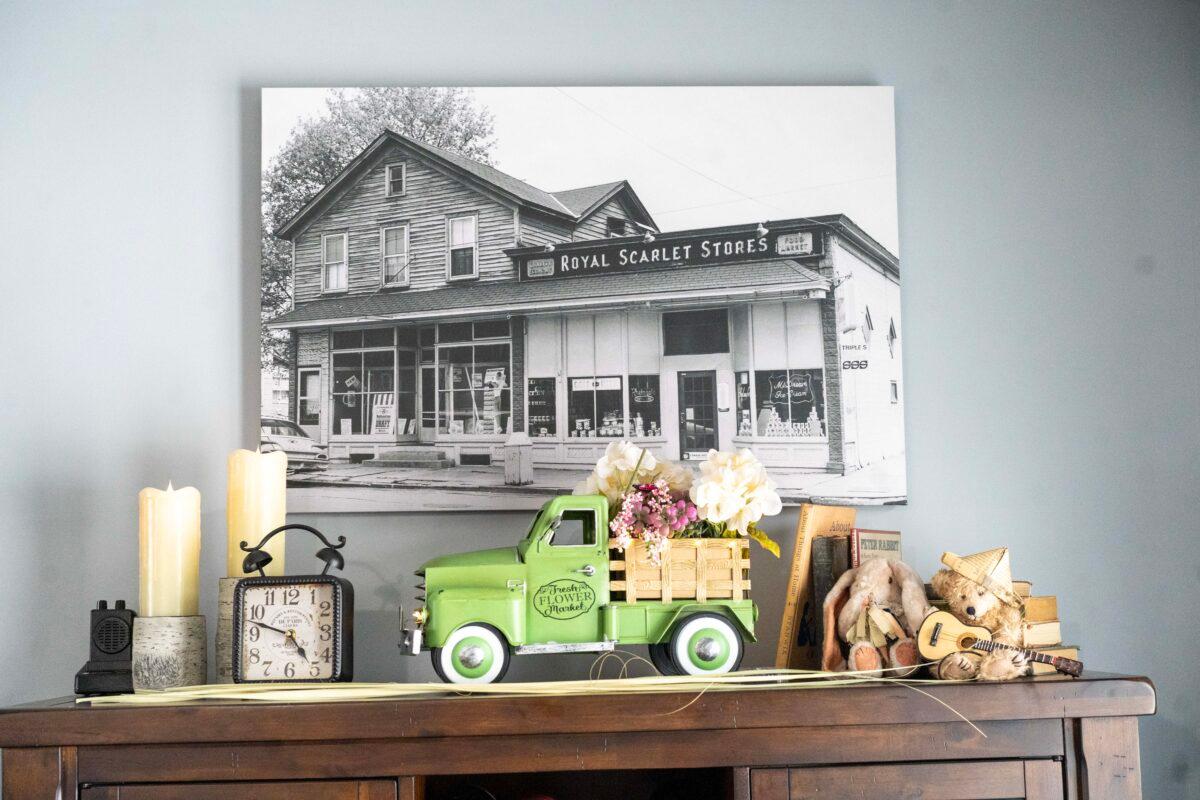 A picture of an old store run by Nancy Dunn's husband's family in the 1920s at her house in Port Jervis, N.Y., on April 7, 2023. (Cara Ding/The Epoch Times)