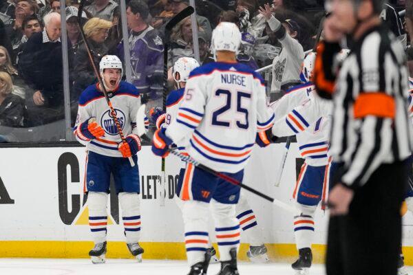 Edmonton Oilers left wing Zach Hyman (18) celebrates with teammates after scoring during overtime of Game 4 of an NHL hockey Stanley Cup first-round playoff series hockey game against the Los Angeles Kings in Los Angeles on April 23, 2023. (Ashley Landis/AP Photo)