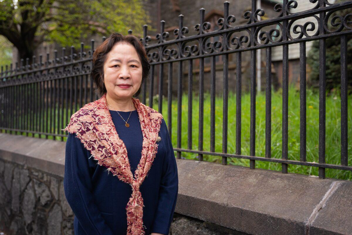 Zhao Ruoxi participates in a parade to call for an end to the Chinese Communist Party's persecution of their faith in the Flushing neighborhood of Queens, N.Y., on April 23, 2023. (Chung I Ho/The Epoch Times)
