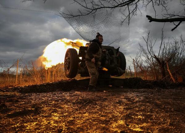 Ukrainian service members from a 3rd separate assault brigade of the Armed Forces of Ukraine, fire a howitzer D30 at a front line, amid Russia's attack on Ukraine, near the city of Bakhmut, Ukraine, on April 23, 2023. (Sofiia Gatilova/Reuters)