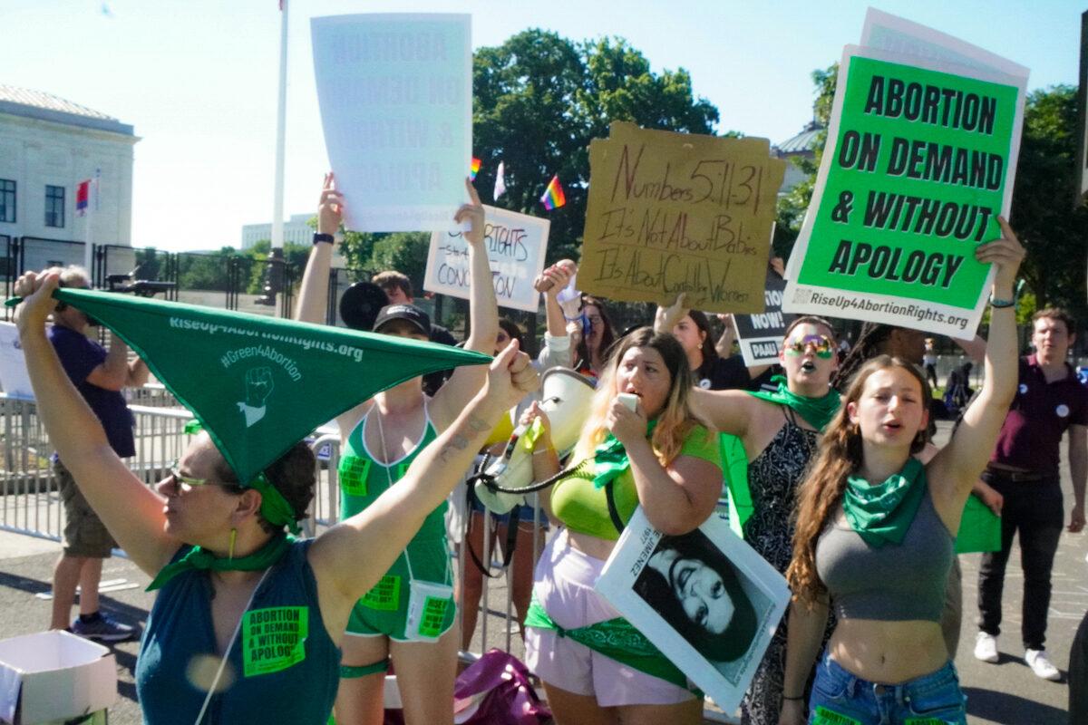 Protestors with Rise Up 4 Abortion Rights call for unrestricted access to abortion outside the U.S. Supreme Court in Washington on June 15, 2022. (Jackson Elliott/The Epoch Times)