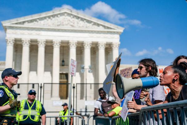 Pro-abortion activists argue with pro-life activists in front of the Supreme Court in Washington on June 26, 2022. (Nathan Howard/Getty Images)