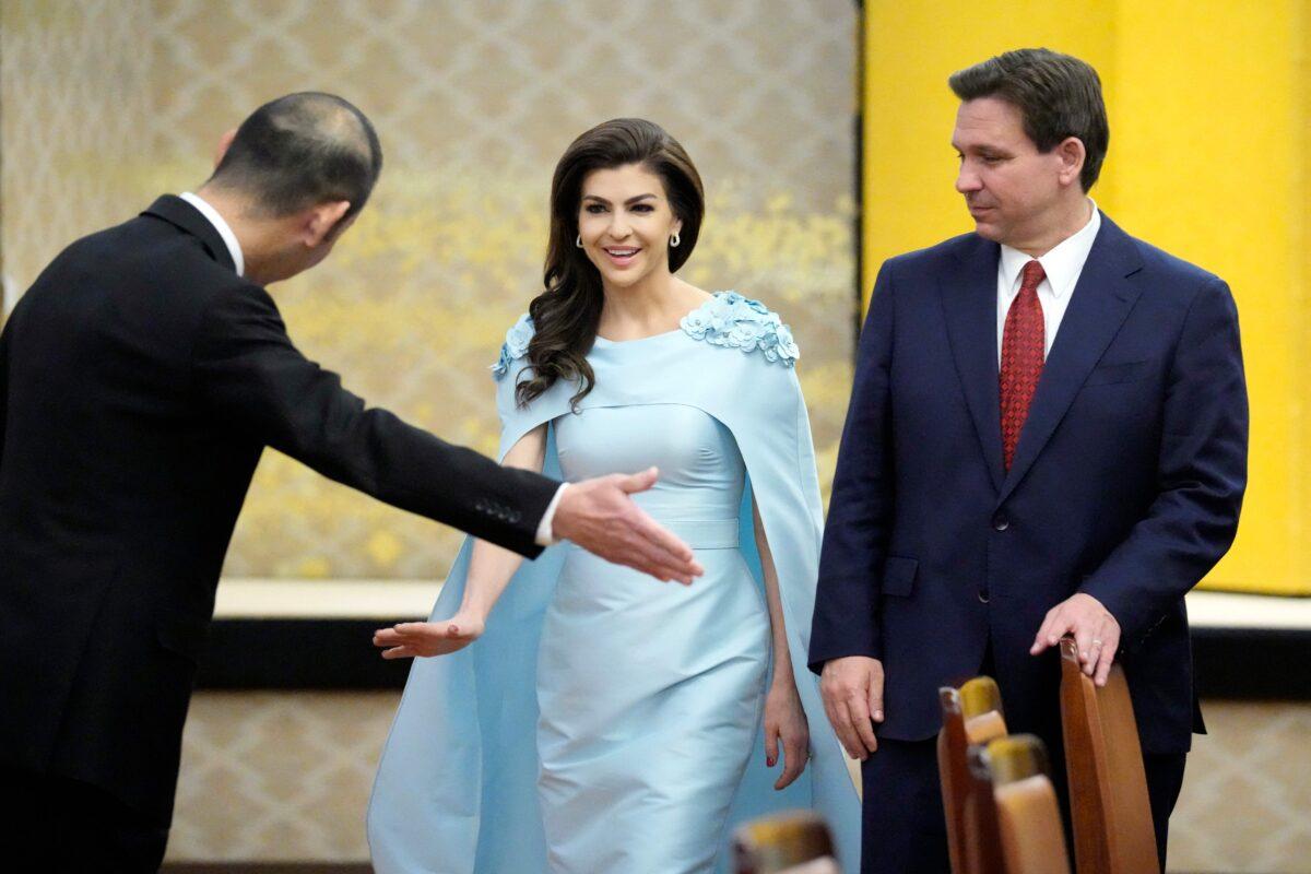 Florida Gov. Ron DeSantis (R) and his wife, Casey DeSantis, are escorted to their seats for a meeting with the Japanese foreign minister at the Iikura Guest House in Tokyo on April 24, 2023. (Eugene Hoshiko/POOL/AFP via Getty Images)
