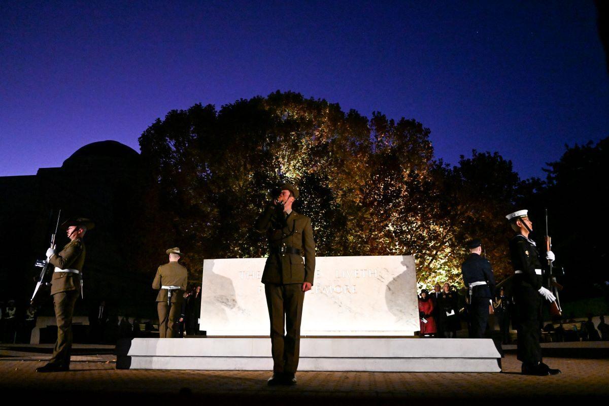 A bugler plays the last post at the Stone of Remembrance during ANZAC Day commemorations at the Australian War Memorial, Canberra, on April 25, 2023. (AAP Image/Lukas Coch)