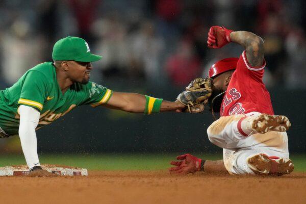 <br/>Los Angeles Angels' Luis Rengifo (2) is tagged out at second by Oakland Athletics left fielder Tony Kemp (5) during the tenth inning of a baseball game in Anaheim, Calif., on April 24, 2023. (Ashley Landis/AP Photo)