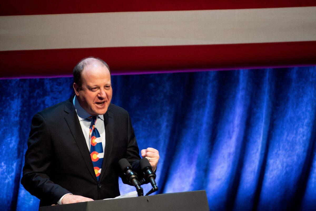 Colorado Gov. Jared Polis speaks before introducing Vice President Kamala Harris before a discussion on tackling climate change at a program in Arvada, Colo., on March 6, 2023. (Jason Connolly/AFP via Getty Images)