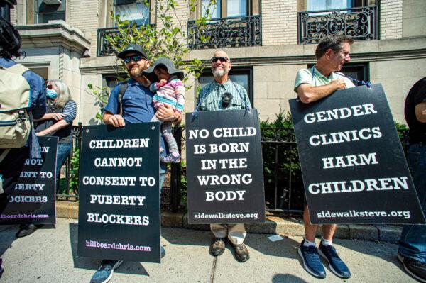 Protesters stand outside of Boston Children's Hospital in Boston, Massachusetts, on Sept. 18, 2022. (JOSEPH PREZIOSO/AFP via Getty Images)