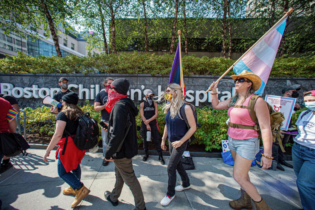 Pro-transgender activists march outside of Boston Children's Hospital in Boston, Massachusetts, on Sept. 18, 2022. (Joseph Prezioso/AFP via Getty Images)