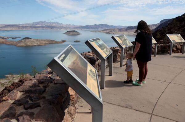 Visitors look at Lake Mead from a vista point in Lake Mead National Recreation Area, Arizona, on August 19, 2022. (Justin Sullivan/Getty Images)