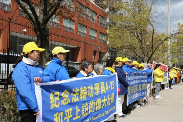Falun Gong practitioners rally outside the Chinese Consulate in Toronto on April 25, 2023, to commemorate the peaceful appeal in Beijing 24 years ago. (Andrew Chen/The Epoch Times)