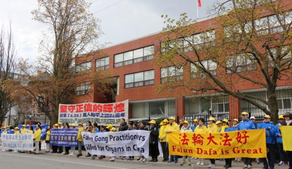 Falun Gong adherents gather outside the Chinese Consulate in Toronto at a rally on April 25, 2023, to commemorate a peaceful appeal in Beijing 24 years earlier, on April 25, 1999, that saw thousands of Chinese citizens attending. (Andrew Chen/The Epoch Times)