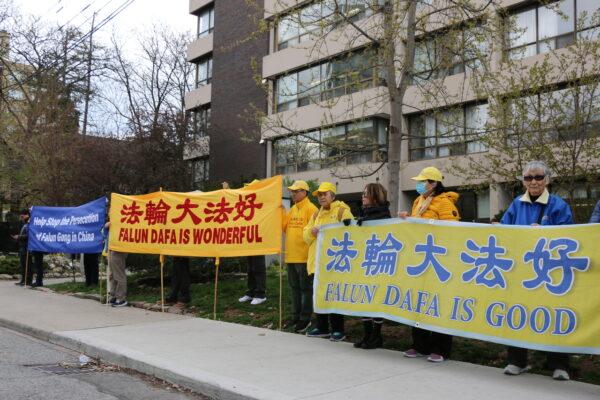 Falun Gong practitioners rally outside the Chinese Consulate in Toronto on April 25, 2023, to commemorate the peaceful appeal in Beijing 24 years ago. (Andrew Chen/The Epoch Times)