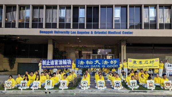 Falun Gong adherents hold a candlelight vigil in front of the Chinese Consulate to mark 24 years of persecution by the Chinese Communist Party in Los Angeles on April 23, 2023. (Emma Hsu/The Epoch Times)