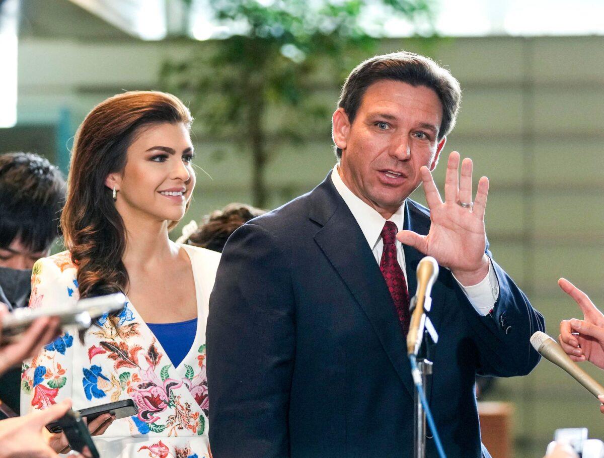 Florida Gov. Ron DeSantis (R) waves to journalists as his wife Casey (L) looks on after meeting Japanese Prime Minister Fumio Kishida at the latter's official residence in Tokyo, on April 24, 2023. (Kimimasa Mayama/POOL/AFP via Getty Images)