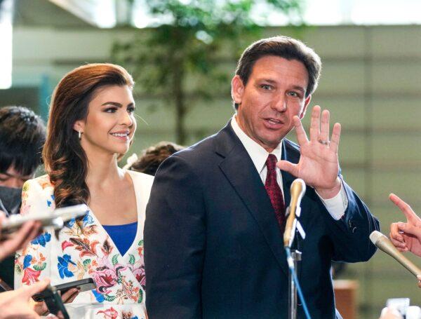 Florida Gov. Ron DeSantis (R) waves to journalists as his wife Casey (L) looks on after meeting Japanese Prime Minister Fumio Kishida at the latter's official residence in Tokyo, on April 24, 2023. (Kimimasa Mayama/AFP via Getty Images)