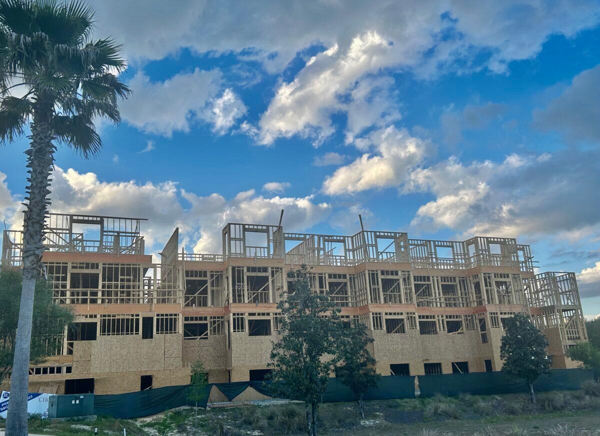 Construction at Choreograph apartment complex in the Celebration Pointe shopping area in Gainesville, Fla., on April 23, 2023. (Nanette Holt/The Epoch Times)