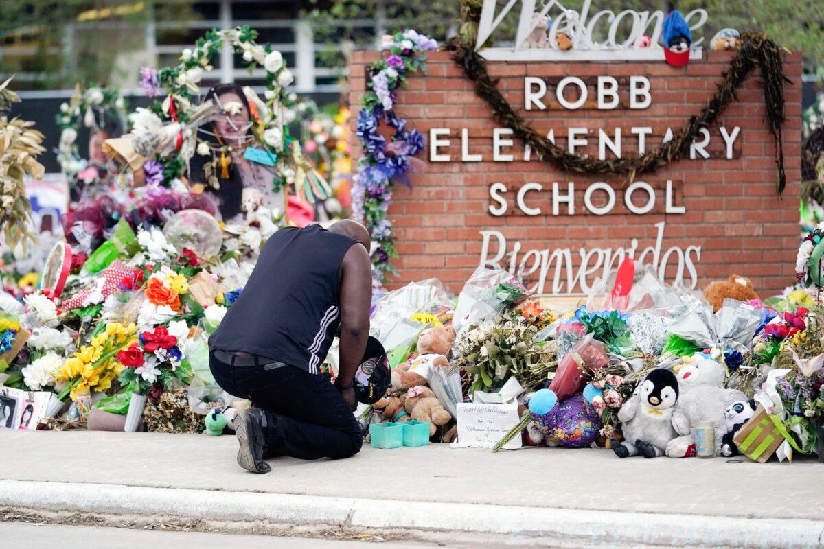 Reggie Daniels pays his respects a memorial at Robb Elementary School in Uvalde, Texas, on June 9, 2022. (Eric Gay, File/AP Photo)