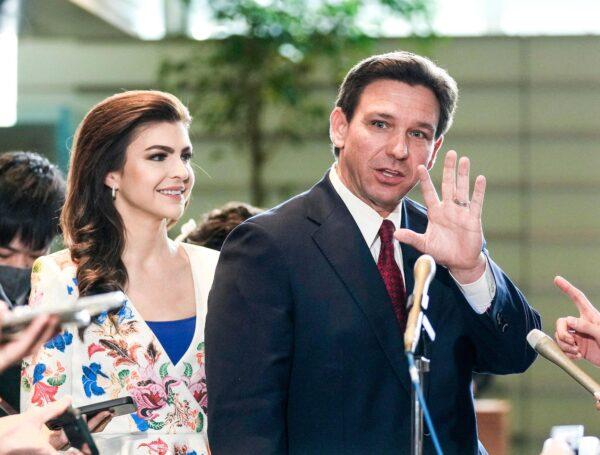 Florida Gov. Ron DeSantis (right) waves to journalists as his wife Casey (left) looks one after meeting Japanese Prime Minister Fumio Kishida at the latter's official residence in Tokyo on April 24, 2023. (KIMIMASA MAYAMA/POOL/AFP via Getty Images)